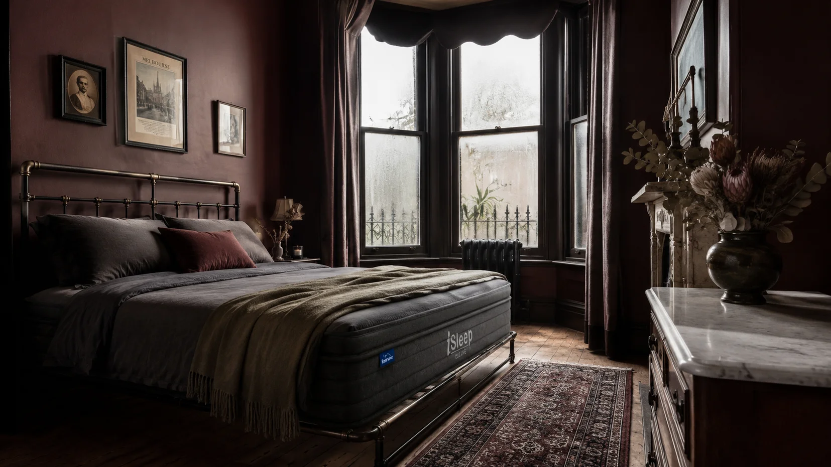 Illustration of an iSleep Deluxe queen mattress in a bright contemporary bedroom with two adults seated near the edge.